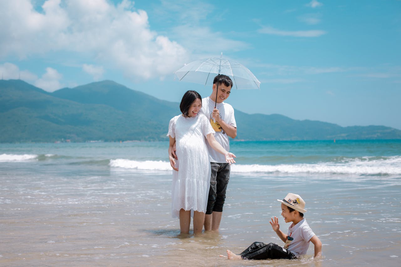 A joyful family spending time together at Da Nang Beach, Vietnam, showcasing happiness and togetherness.